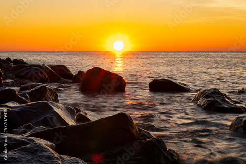 Stone sea shore during a beautiful sunset