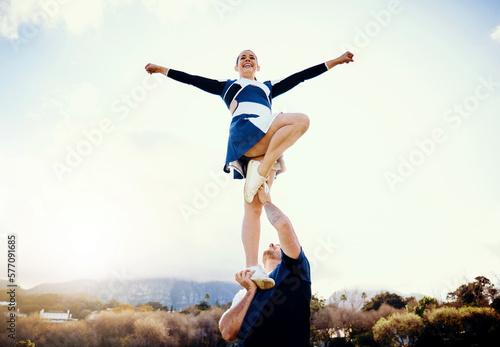 Cheerleading student, lift stunt and mockup outdoor for on cheer camp with exercise and blue sky. Students, air pose and strong male athlete doing training and workout with cardio and mock up