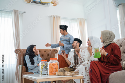 Muslim friends gather and chat together to celebrate Eid at home