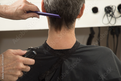 Closeup of Stylist Combing Hair