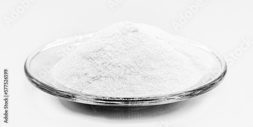 lactase enzyme, food supplement, powder containing the enzyme lactase. · The enzyme lactase helps to digest the lactose present in food. isolated white background