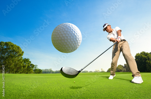 Motion action of golfer teeing off with drivers.