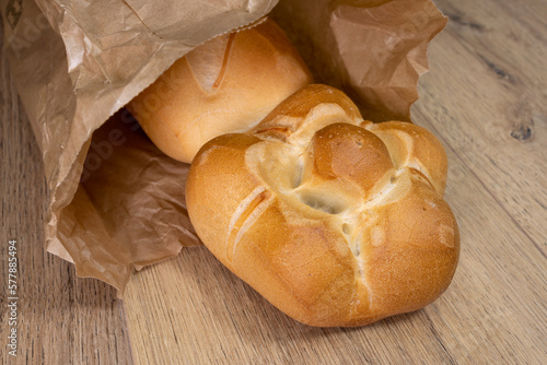 typical Milan tradition bread "michetta" wooden table