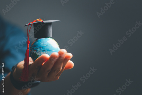 Graduation cap with Earth globe. Concept of global business study, abroad educational, Back to School. Education in Global world, Study abroad business in universities in worldwide. language study