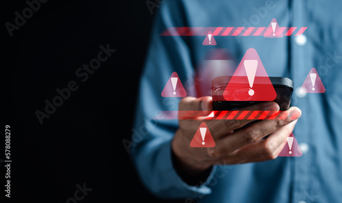 System warning caution sign on smartphone, scam virus attack on firewall for notification error and maintenance. Network security vulnerability, data breach, illegal connection and information danger.