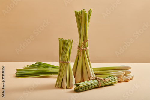 Several bunches of lemongrass (Cymbopogon citratus) are decorated on a pastel background with front view. Lemongrass can be used in cooking or as a herbal to enhance health