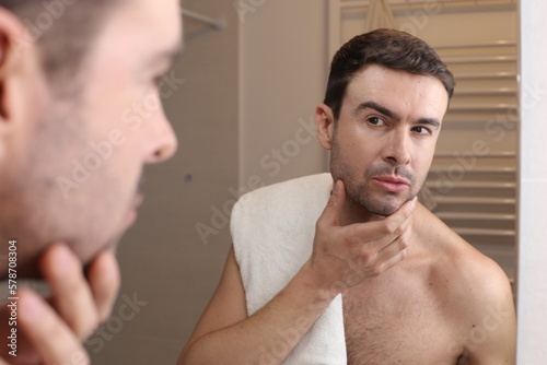 Man feeling overconfident in the bathroom