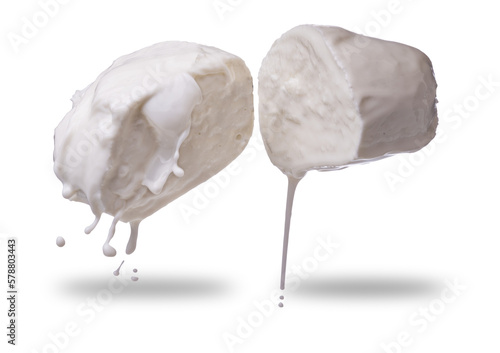 Mozzarella cheese cut in half with dripping milk