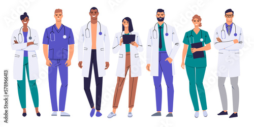 A team of medical workers. Doctors, nurses isolated on white. Characters in white coats and scrubs. A group of medical personnel are standing in full height. Male and female medics. Flat vector.