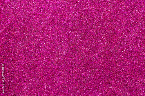 Abstract background filled with shiny fuchsia glitter