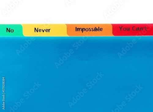 Folders tag with words NO NEVER IMPOSSIBLE YOU CAN'T, concept of NAYSAYERS, a person who criticizes or oppose, expresses negative or pessimistic views that something is not possible or will fail