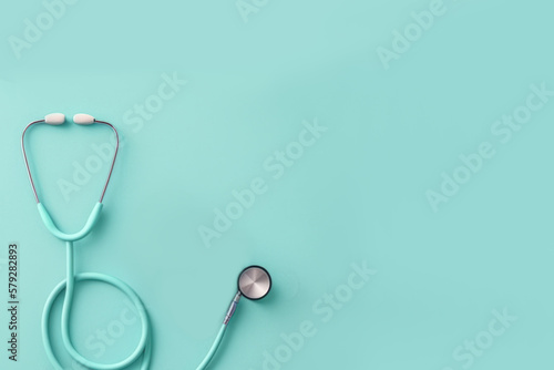 Top view of stethoscope on color background with empty copy space, flat design. Health medical concept. Generative ai.