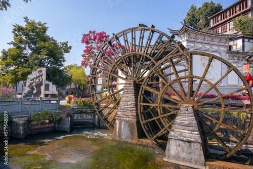 Waterwheel-driven canals filled of Lijiang Old Town is a well-preserved old city of ethnic minorities with brilliant culture of chinese house in in Yunnan, China