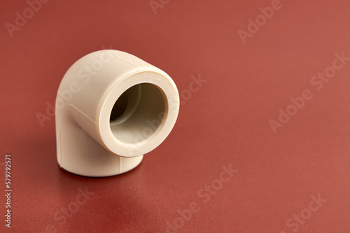 The connection angle of the thermoplastic pipe at an angle of 90 degrees. Concept of installation of water supply and sewage systems.