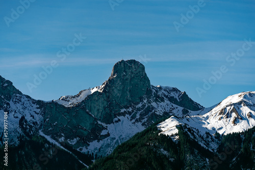 Panoramic landscape with Stockhorn peak seen from City of Thun on a sunny winter day. Photo taken February 21st, 2023, Thun, Switzerland.