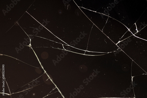 glass broken into a large number of pieces and cracks