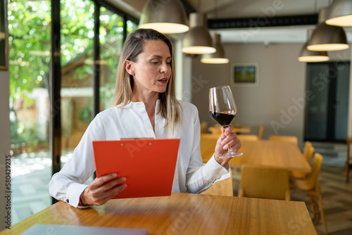 woman female oenologist wine quality check at winery