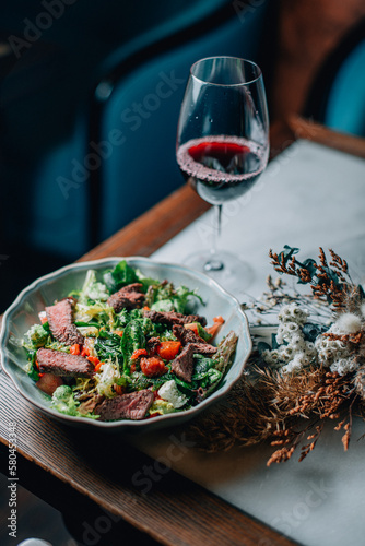 warm salad with herbs and vegetables with red wine