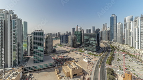 Panorama showing Bay Avenue with modern towers residential development in Business Bay aerial timelapse, Dubai