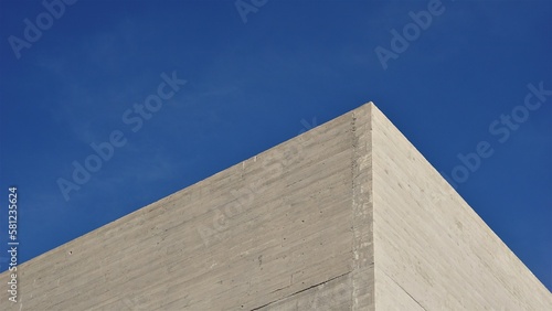 corner of concrete facade against the sky