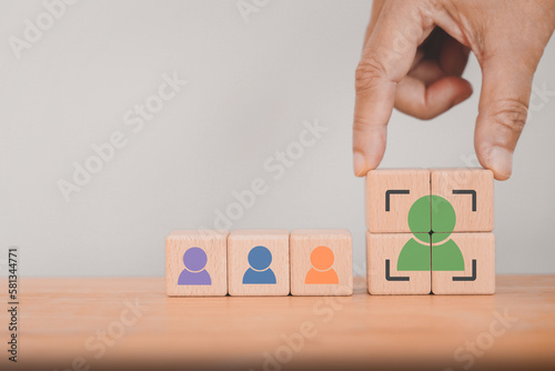 senior businessman's hand complete crop icon, people inside on wood cube for Buyer persona and target customer, recruitment, leader concept. Buyer or customer psychology profile or characteristics