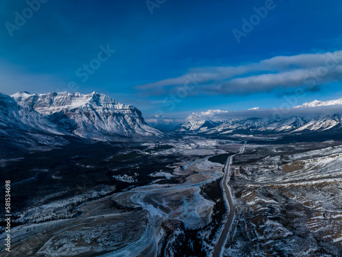 aerial view of highway eleven in jasper and banff natioanl park towards Saskatchewan River Crossing with mountains on background