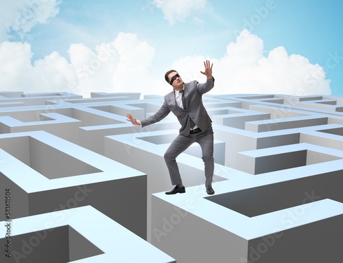 Businessman trying to escape from maze