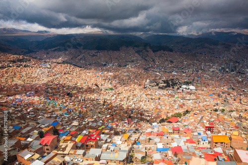 Aerial Drone Fly Above La Paz, Bolivia, Crowder Metropolitan City, Houses, Skyscrapers and Andean Cordillera Mountain Range in the Background
