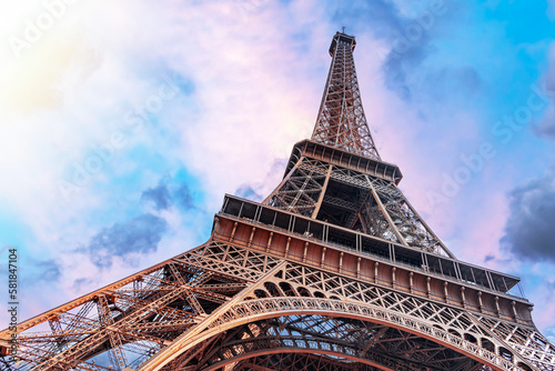 The Eiffel Tower in Paris against the backdrop of a beautiful evening sky.