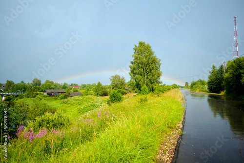 landscape with river and rainbow