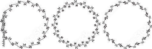 Set of three vector hand drawn floral frames isolated on white background. Round black wreath with plants