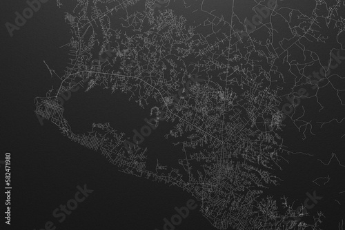 Street map of Monrovia (Liberia) on black paper with light coming from top