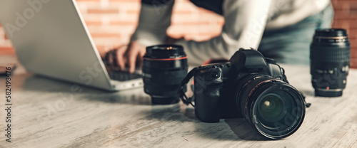 photographer hand camera working in desk