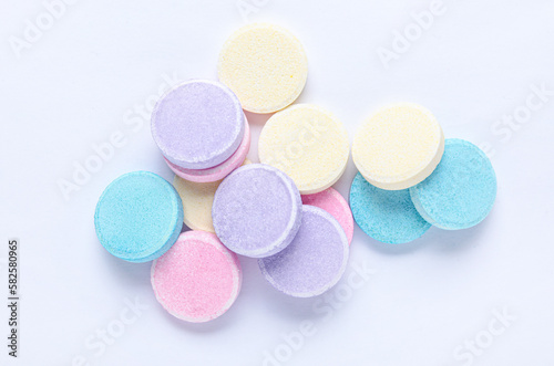 Colorful soluble tablets isolated on white background