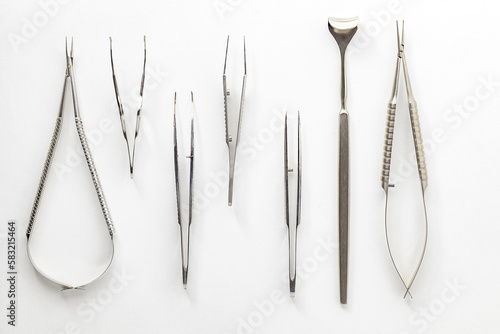 Surgical ophthalmological medical instruments, scissors, tweezers, on white background