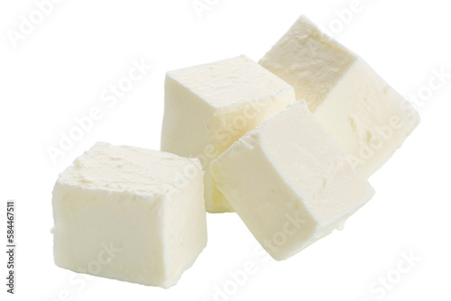 Cubes of feta cheese are isolated on a white background. 