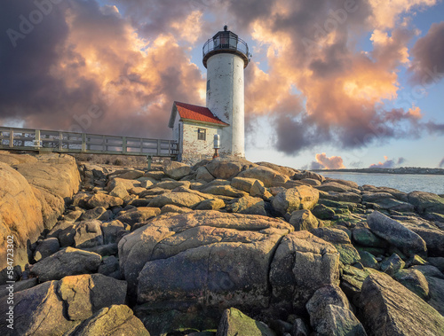 Anisquam light house at sunset off the coast of Gloucester, MA. USA