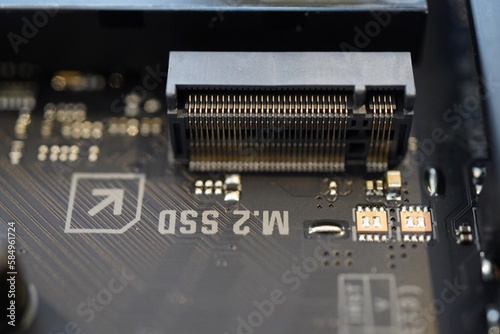 Closeup of an M.2 SSD slot on a Asus TUF Gaming Z790-Plus Wifi motherboard