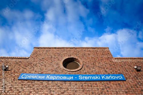 Signage indicating Sremski Karlovci in latin and cyrillic alphabet on the train station of Sremski Karlovci (Zeleznicka Stanica), belonging to Serbian railways, between belgrade and Novi Sad, renovate