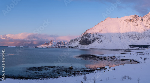 Fantastic colorful sunset on Skagsanden beach. Amazing Norway natural seascape. popular touristic attraction. Lofoten islands is a Best famouse travel locations. Scenic Image of nature landscape.