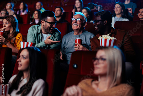 Multigenerational friends in movie theater.