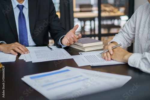 Lawyer Legal counsel presents to the client a signed contract with gavel and legal law. justice and lawyer Business partnership meeting concept.