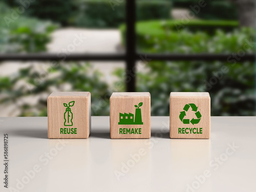 Circular economy. Sustainable strategy approach to eliminate waste and pollution for business and environment, Wooden cubes with the words reuse, remake and recycle and symbols.