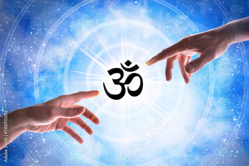 Hands pointing hinduism symbol with blue universe background