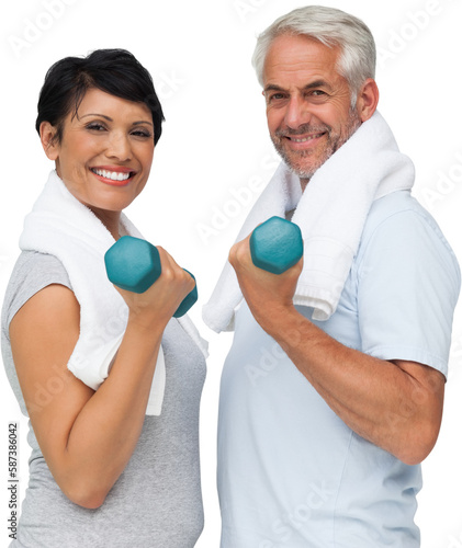 Fit mature couple exercising with dumbbells