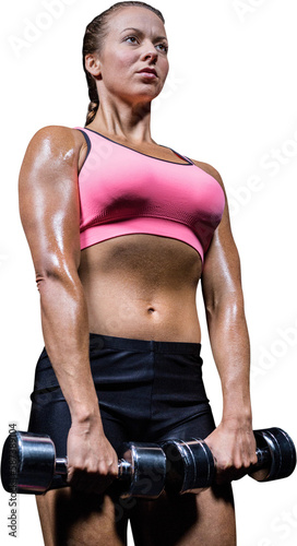 Low angle view of woman exercising with dumbbells