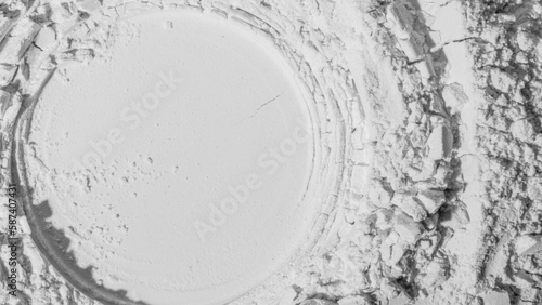 Texture of powder, flour, sand. White. extruded circle. Textured, cracked. White. Banner, advertising. Empty space. For an inscription.