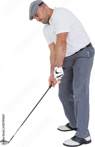 Golfplayer about to swing a golf ball