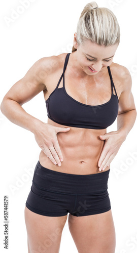 Woman looking at abdominal muscles