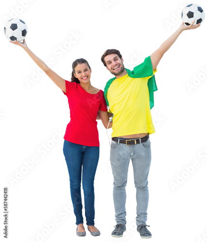 Football fan couple cheering and smiling at camera